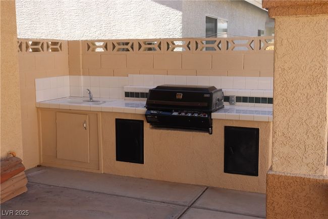 View of patio / terrace featuring area for grilling and a sink | Image 63