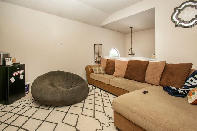 Family room with lofted ceiling | Image 17