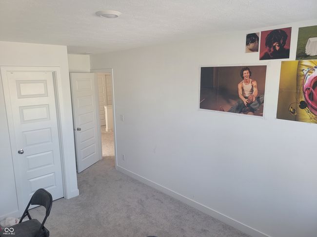 unfurnished bedroom with carpet floors and baseboards | Image 15