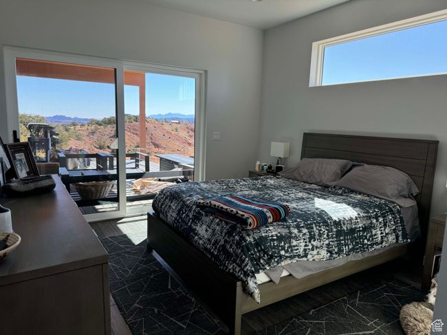 Bedroom in primary home with access to exterior and a mountain view | Image 8