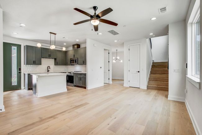 Kitchen with appliances with stainless steel finishes, light countertops, ceiling fan, recessed lighting, and decorative backsplash | Image 7