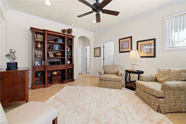 Tiled featuring crown molding, arched walkways, a ceiling fan, recessed lighting, and baseboards | Image 6