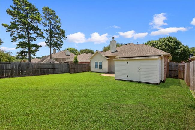 Storage shed in back yard stays. | Image 22