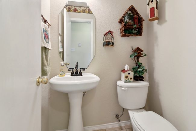 Bathroom featuring baseboards and toilet | Image 15