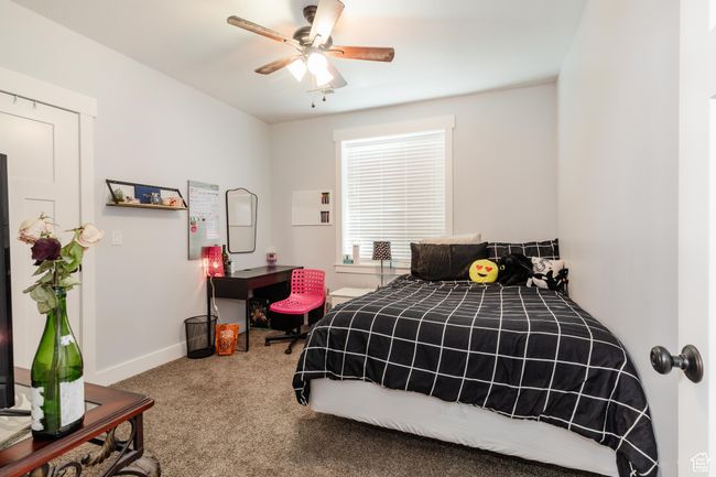 Bedroom featuring carpet flooring and ceiling fan | Image 32