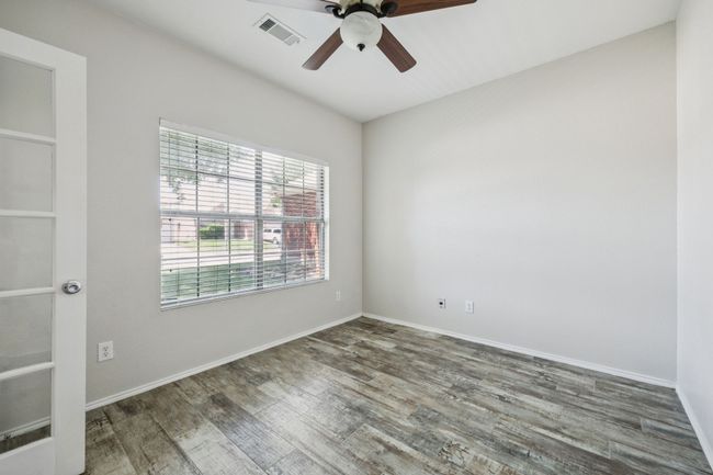 Unfurnished room featuring ceiling fan and wood finished floors | Image 5