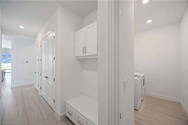 Mudroom featuring baseboards, independent washer and dryer, and recessed lighting | Image 23