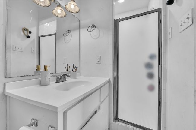 Full bathroom featuring a stall shower and vanity | Image 11