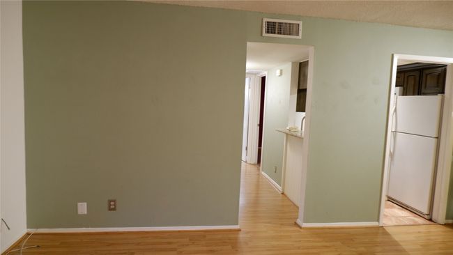Hallway with light wood-type flooring | Image 7