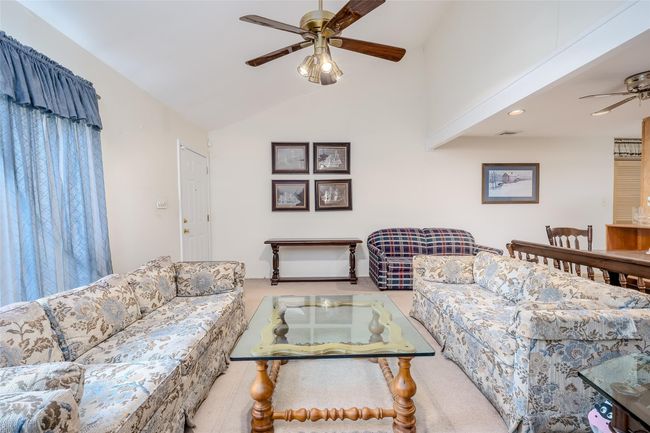 Living room with ceiling fan, carpet, recessed lighting, and high vaulted ceiling | Image 10