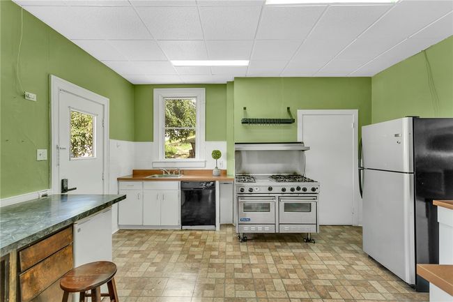 The kitchen has a large oantry and a step saving Layout. | Image 19