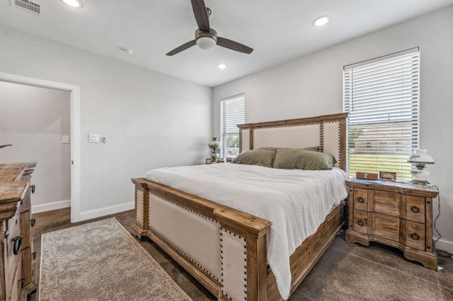 Bedroom with recessed lighting, dark carpet, baseboards, and a ceiling fan | Image 12