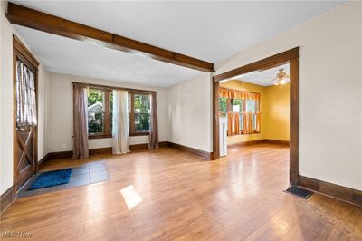 Living room with ceiling beam , and light hardwood / wood-style flooring | Image 2