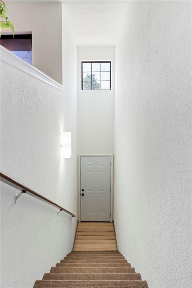 Stairs with a textured wall | Image 7