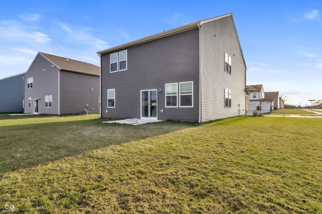 rear view of property featuring a yard and a patio area | Image 32