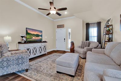 View of living room looking toward front door entry. | Image 3