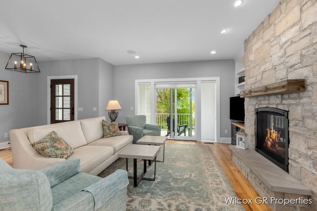 Inviting living with easy access to front porch. | Image 18