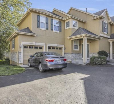 View of front facade with a garage | Image 1