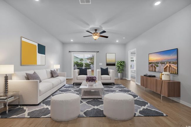 Living area featuring recessed lighting, wood finished floors, baseboards, and ceiling fan | Image 6