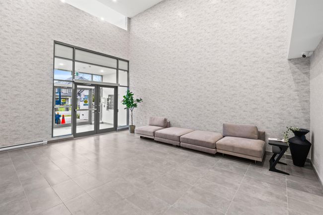 Lobby with a towering ceiling and a surveillance system | Image 26