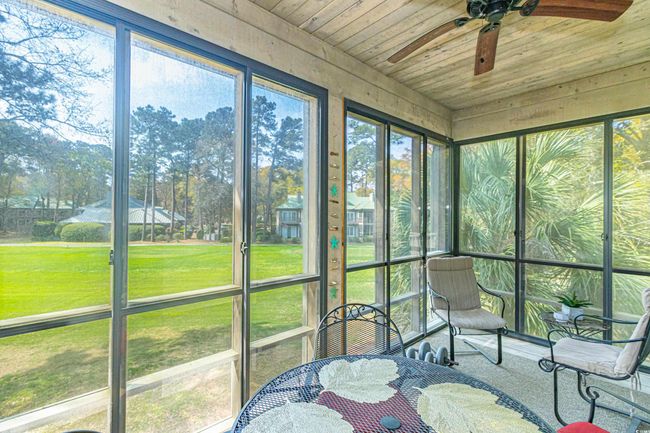Sunroom with a ceiling fan | Image 12
