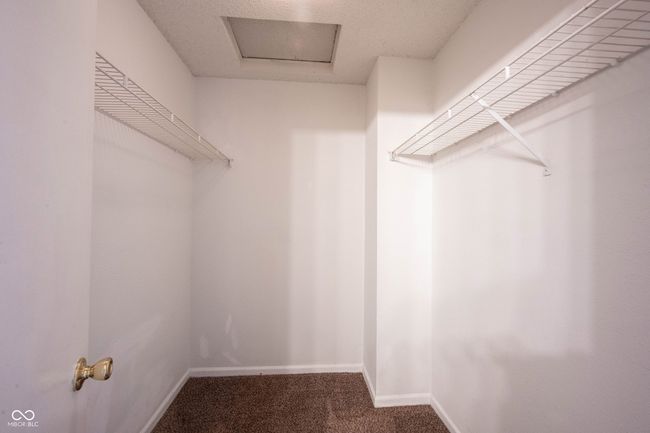 spacious closet featuring carpet floors | Image 36