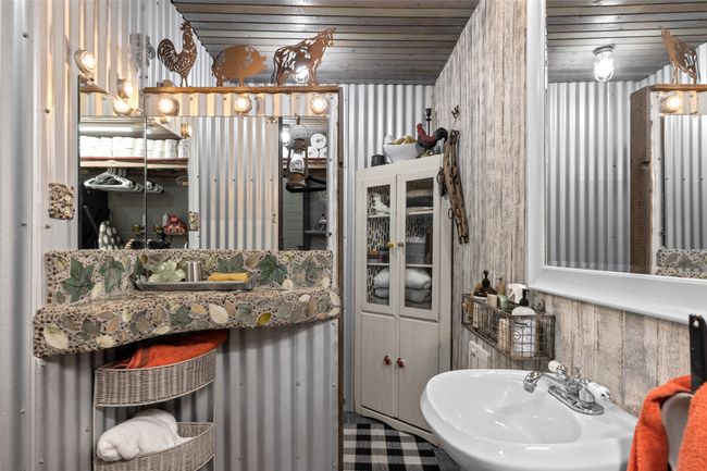 Bathroom with a sink and wooden ceiling | Image 35