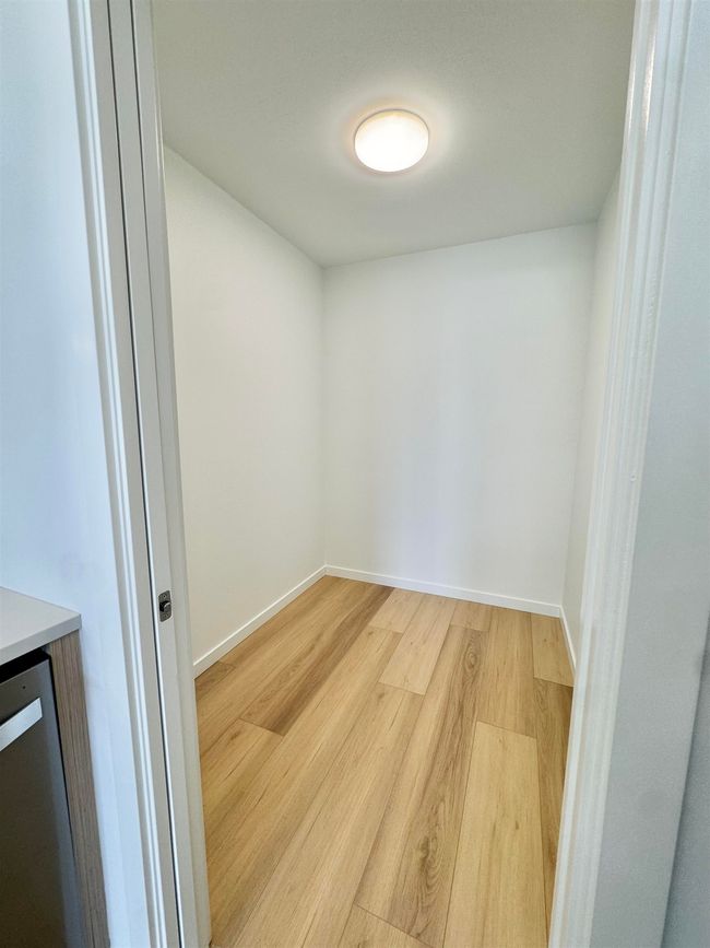 Spare room with baseboards and light wood-style floors | Image 9