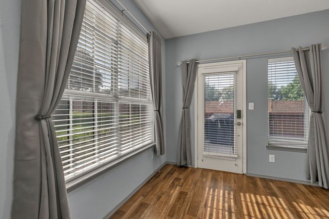Empty room featuring dark wood-style floors | Image 11