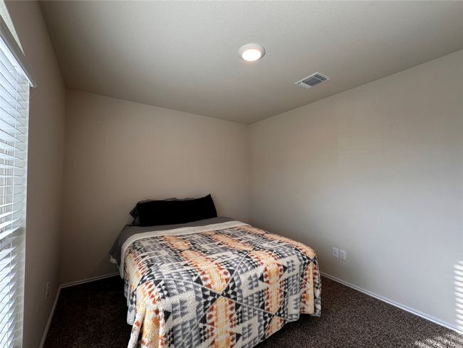 Bedroom with carpet floors and baseboards | Image 7