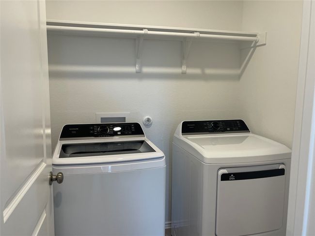 Washroom featuring independent washer and dryer | Image 9
