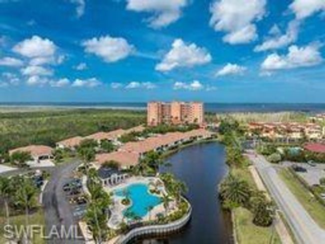 Aerial view of a nearby body of water and a pool area | Image 36