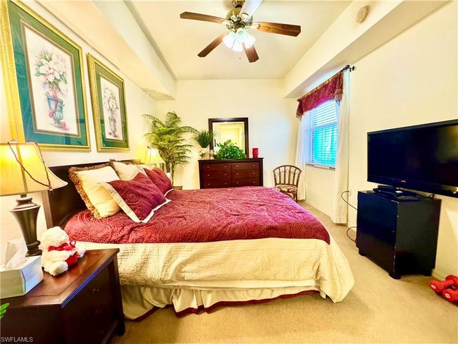 Carpeted bedroom with ceiling fan | Image 18