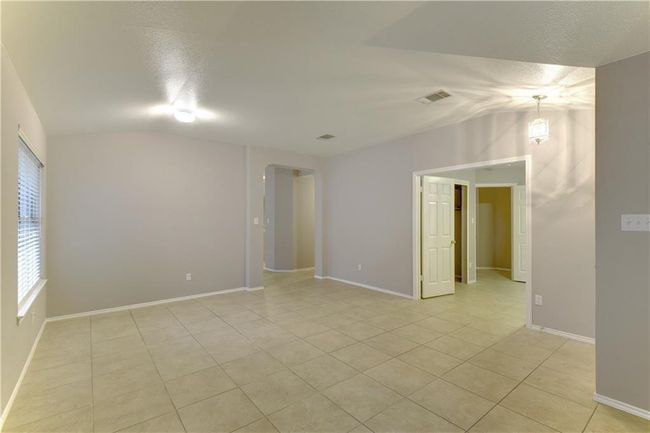 Bathroom with a stall shower, double vanity, and tile patterned floors | Image 11