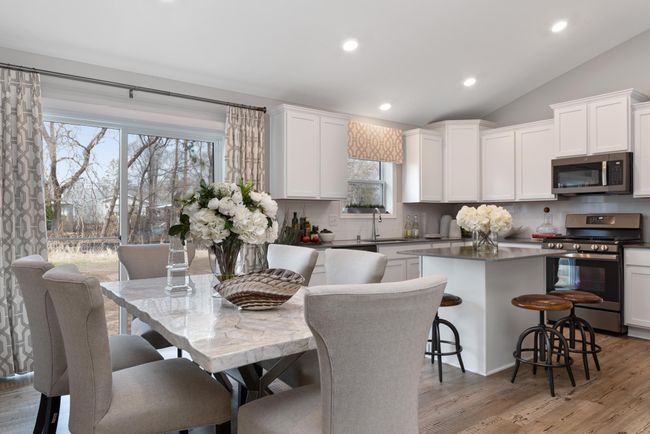 (Photo of decorated model, actual home's finishes will vary) Soaked in natural sunlight, the homes dinning area is a great place to spend time! | Image 9