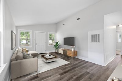 Living room featuring lofted ceiling and hardwood / wood-style flooring | Image 3