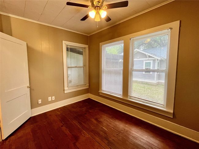 Here is a bedroom. Notice all of the natural lighting coming from the windows. | Image 9