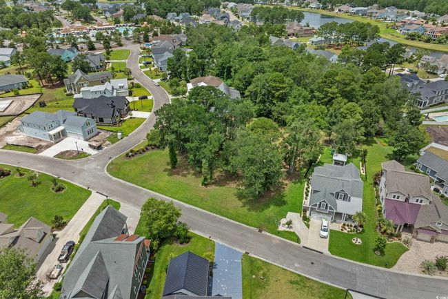 Aerial view of property's location featuring nearby suburban area and a large body of water | Image 7