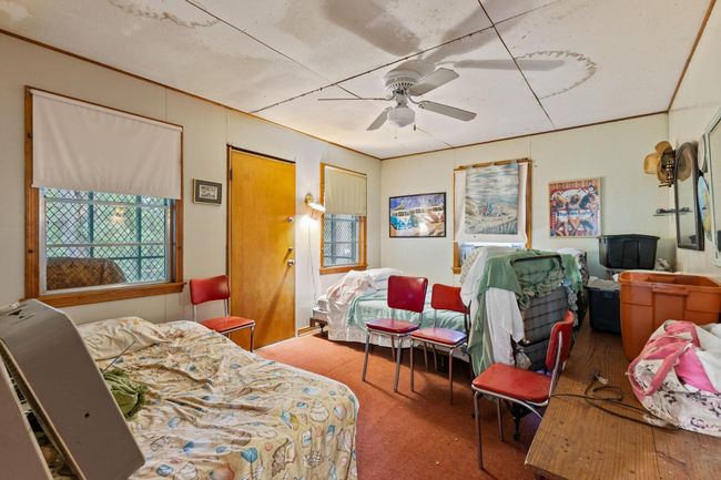 Bedroom with carpet floors and ceiling fan | Image 27