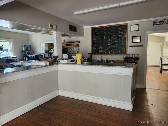 Countertop bar separating main area and serving area. | Image 11