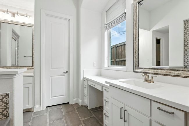 Bathroom with vanity and tile patterned floors | Image 22