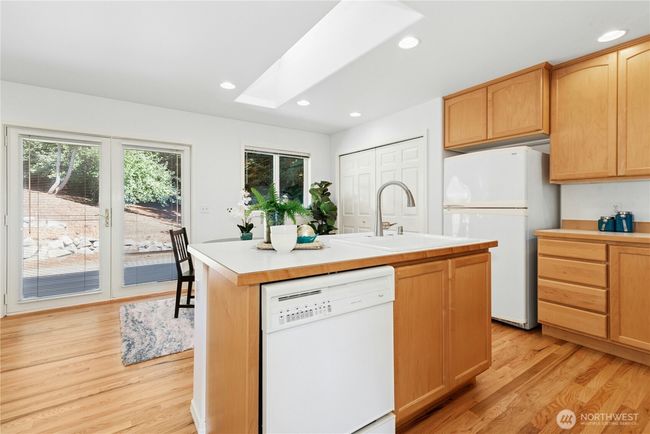 kitchen walks out to the large backyard | Image 8