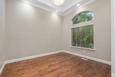 Formal entry with high ceilings, ornamental molding, and hardwood / wood-style flooring | Image 3