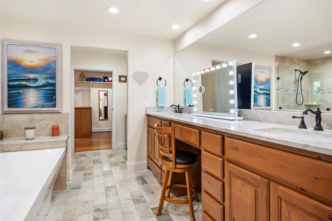 Primary bathroom - look at the counter height on these dual sinks with granite countertops. Do you see that beautiful marble flooring? | Image 24