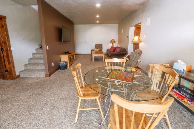 Dining area featuring stairs, carpet floors, recessed lighting, and baseboards | Image 50