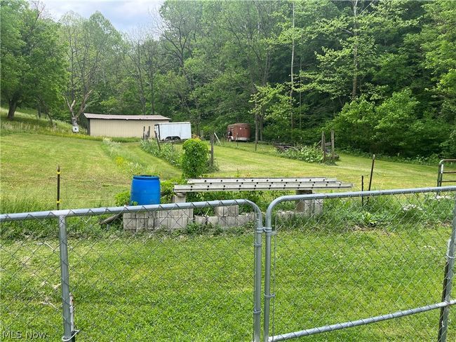 View of yard featuring a shed | Image 14