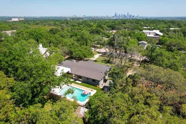 Birds eye view of property with a view of trees and downtown Austin skyline | Image 39