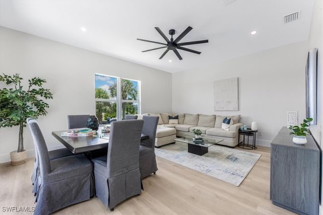Dining space with a ceiling fan, light wood-style floors, and recessed lighting | Image 21