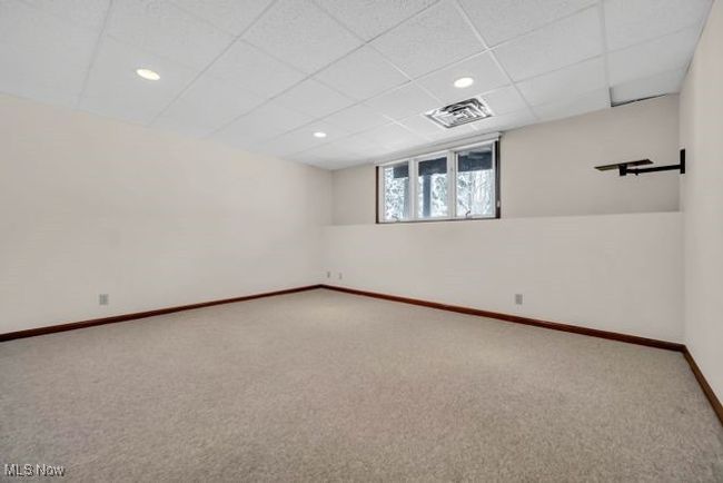 Carpeted spare room with a drop ceiling | Image 40