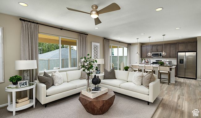 Living area featuring ceiling fan, light wood-style floors, and recessed lighting | Image 4